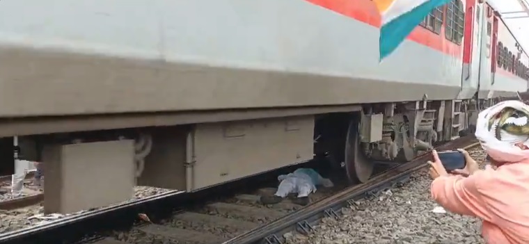 protester under railway in Bihta