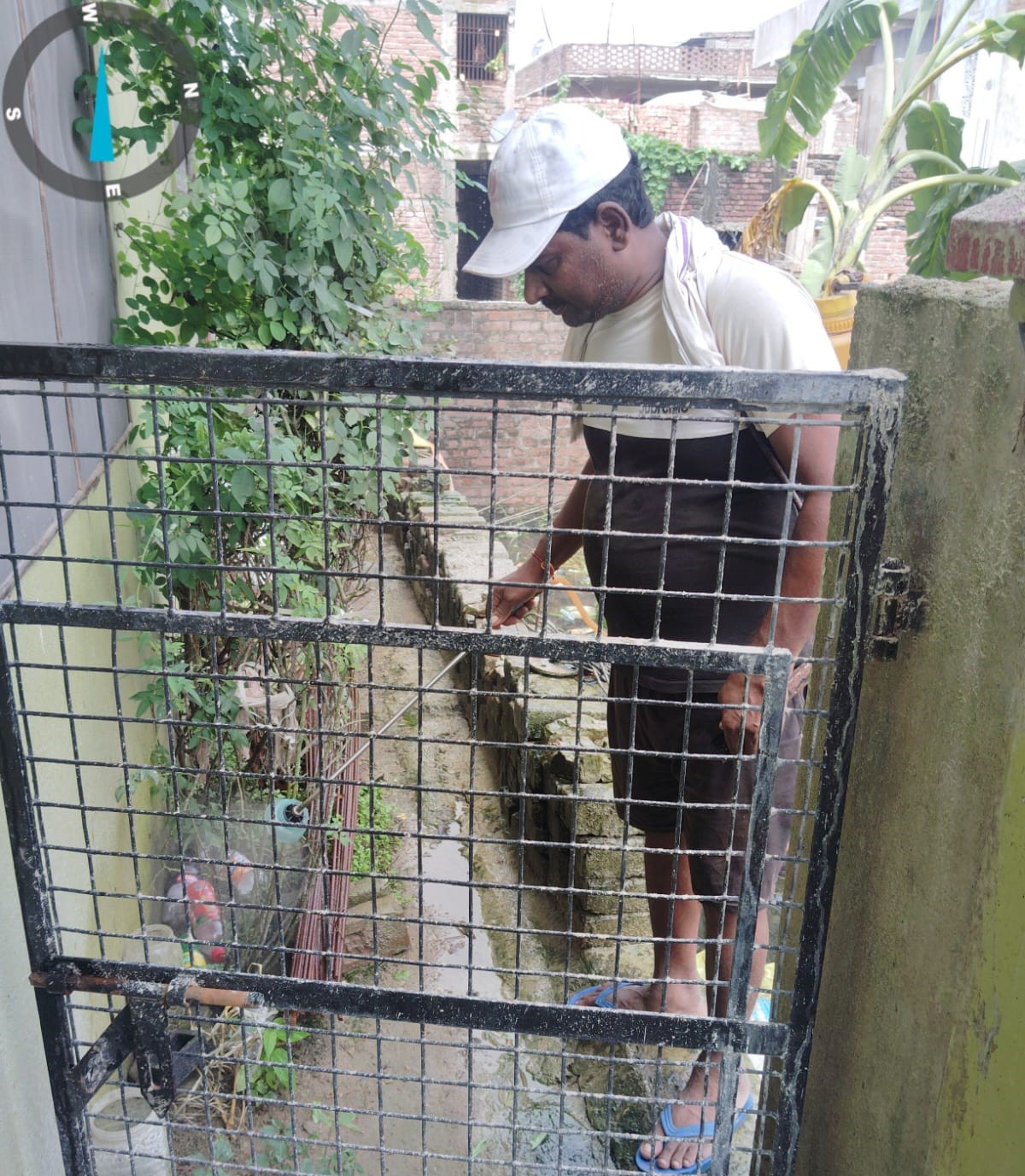 Municipal workers spraying anti-larvae solution on rooftops and streets in Patna to prevent mosquito-borne diseases.