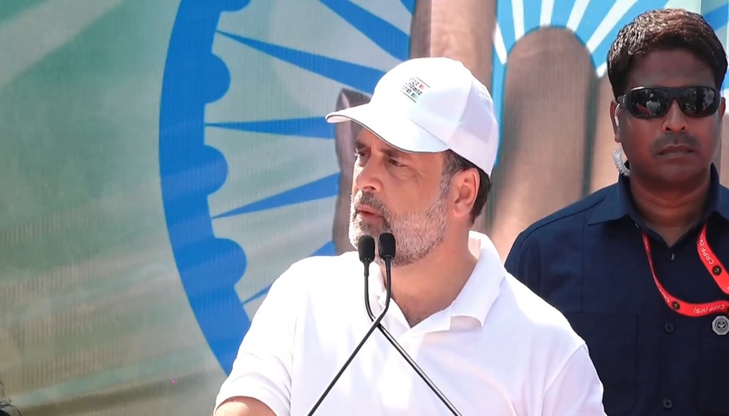 Rahul Gandhi addressing a large crowd in Patna during the Voter Rights Yatra, gesturing passionately while speaking about alleged vote theft by the BJP.