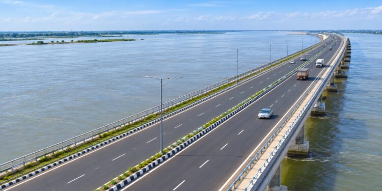 Representative AI image of a four-lane road running over the Kosi River on a raised bridge