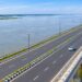 Representative AI image of a four-lane road running over the Kosi River on a raised bridge