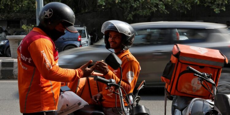 Gig worker using a mobile app for delivery work in Bihar