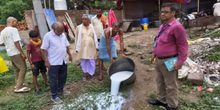 Food safety officials inspect milk samples at a dairy in Danapur, Patna