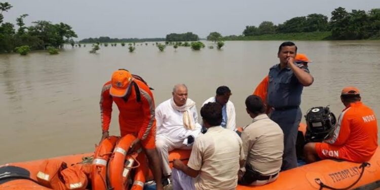 Patna district administration teams carrying out flood relief and rescue operations in affected areas