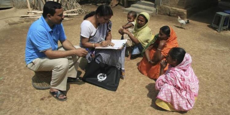 Enumerators conducting household surveys for Census