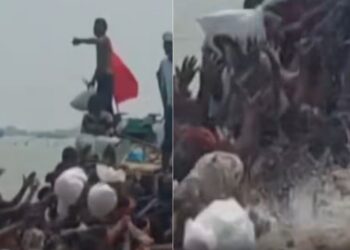 people jump in floodwater as ration reach on boat in Manas area of Danapur in Bihar