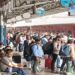 Passengers waiting on a crowded railway platform amid Bihar–Delhi train cancellations