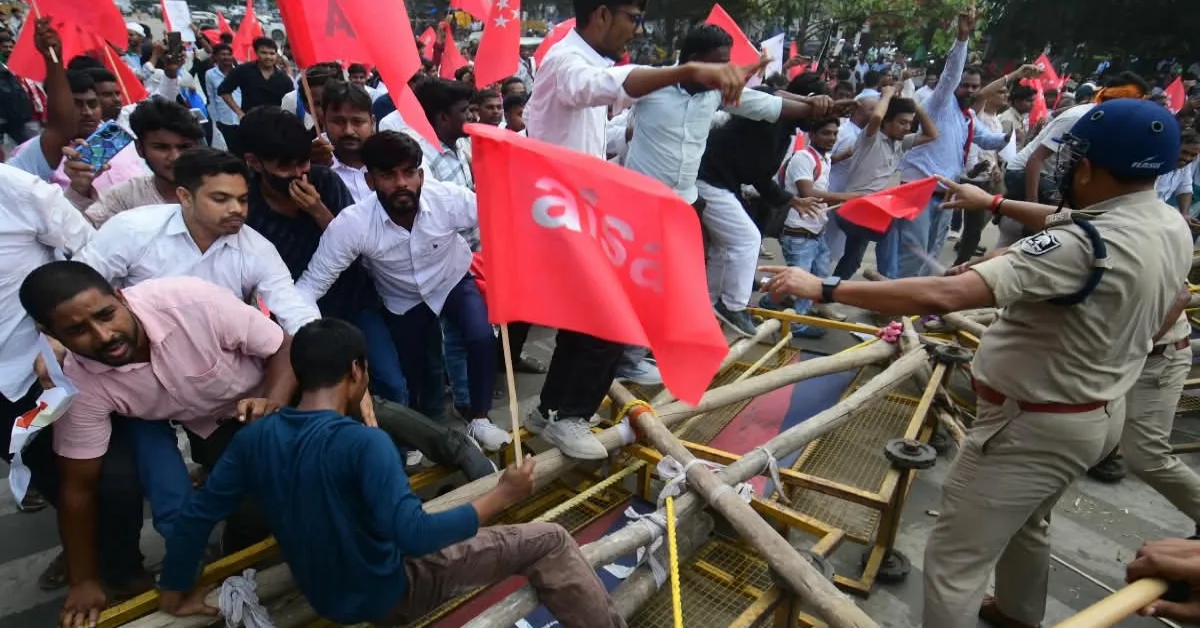 AISA protesters breach police barricades near Gandhi Maidan during a march towards Lok Bhavan in Patna against the Special Intensive Revision of electoral rolls.