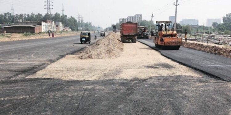 Flood-damaged road undergoing repair work in Patna