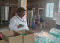 Food safety officials inspect packaged drinking water bottles with suspected fake branding in Patna.